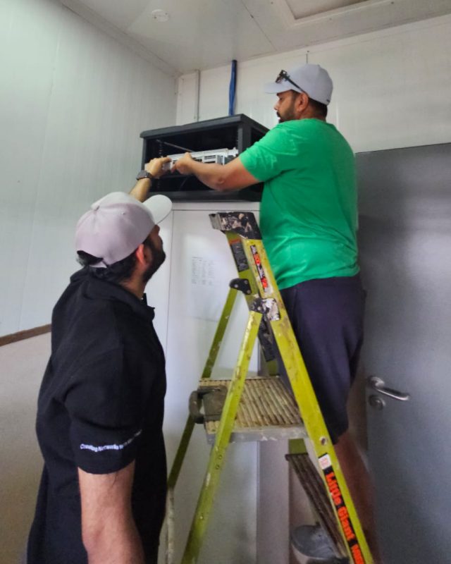 Sprint Networks engineers installing network equipment at a remote site