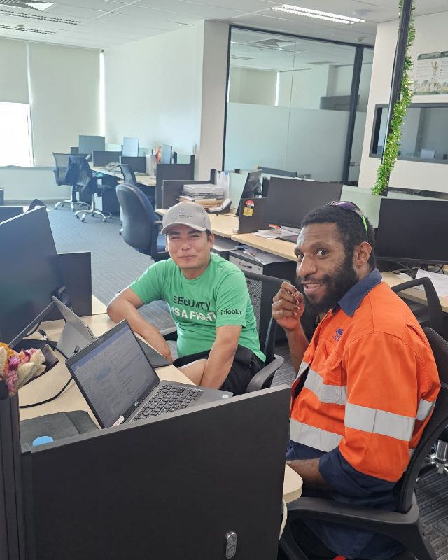 Sprint Networks engineer working with a local team member in PNG